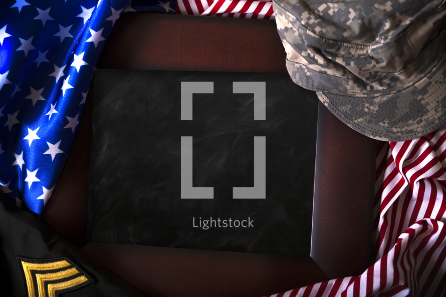 blank chalkboard with American flag and military uniform border 