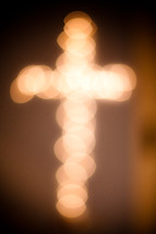 Blurred out lights form the cross