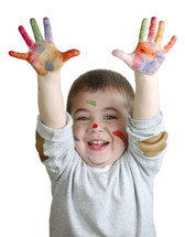 child with paint on his hands 