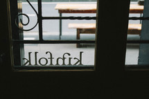 kinfolk sign in a window 