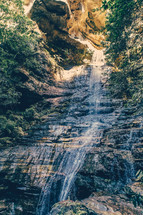 cascading waterfall down a cliff 