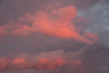 pink, blue, and purple cotton candy clouds in the sky at sunset 