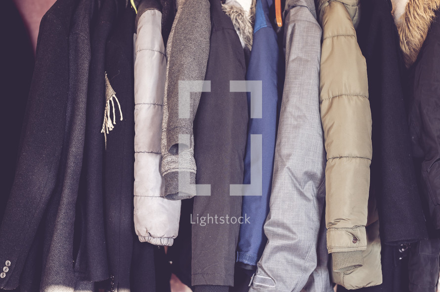 coats in a coat closet 