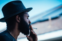 a man smoking a cigarette 