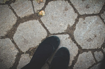 feet on paver stones 