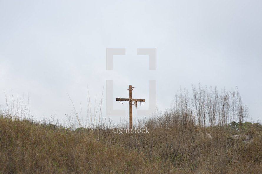 a cross on a hill top 