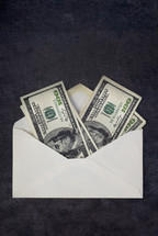 Money Envelope full of hundred dollar bills.