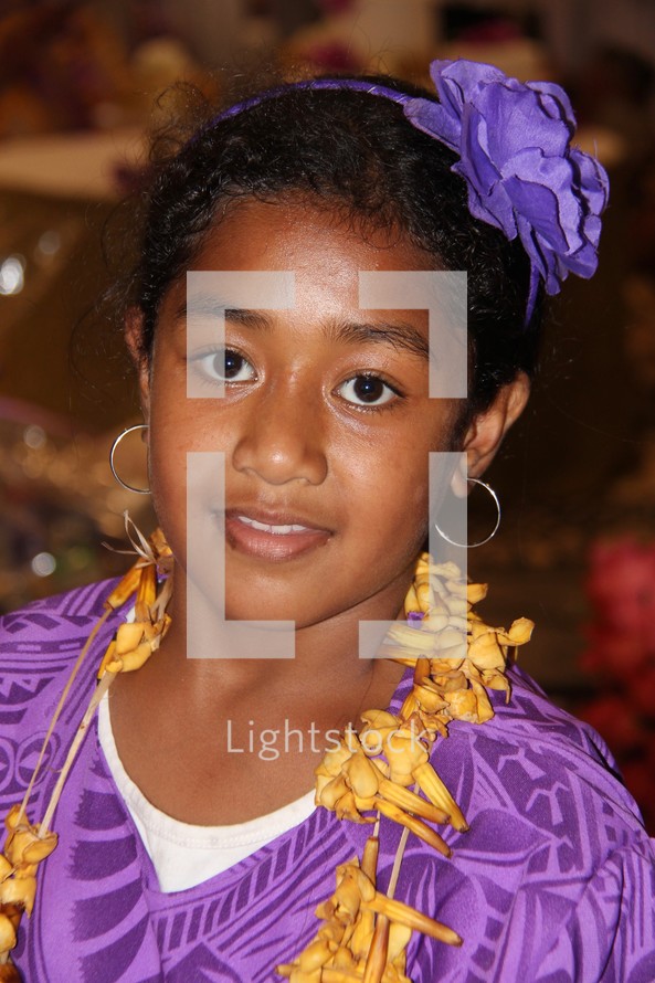 teen girl wearing a lei 