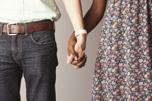 Mixed race couple holding hands 