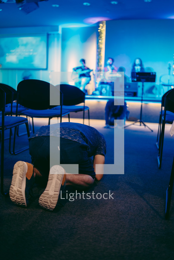 kneeling on a church floor 