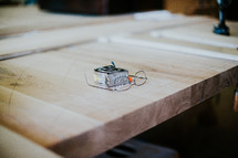 measuring tape and glasses on a workbench 
