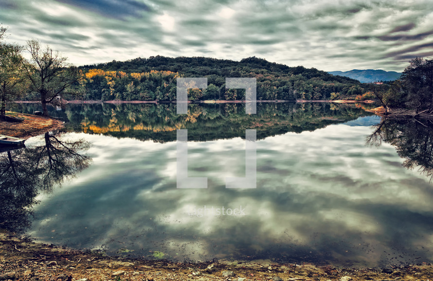 Dramatic landscape of a lake in cloudy weather. Lake San Cipriano, in Tuscany 