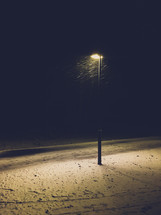 street lamp and winter snow at night 