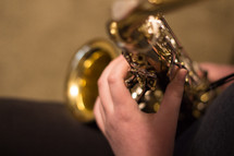 playing a saxophone 