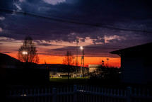sky at sunset above a ballpark 