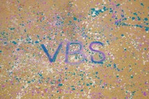 letters VBS on paint splatter 