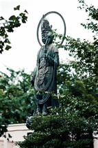 statue in a garden 