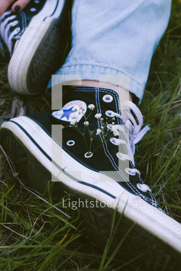 converse sneakers in grass