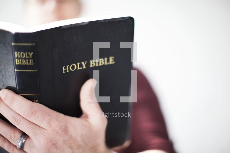 Man reading a Bible 