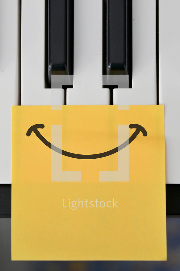 piano keys and smiley face 