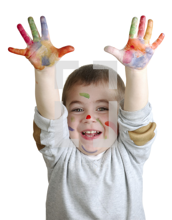 child with paint on his hands 