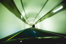 a car driving through a tunnel 