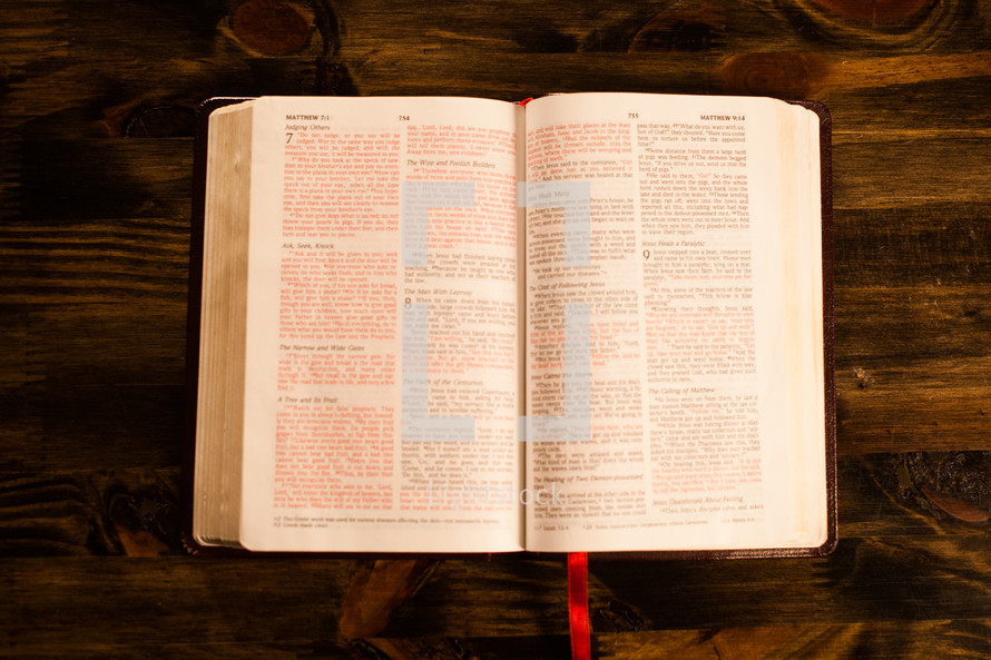 an open Bible on a desk 