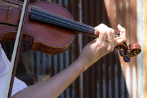 a man playing a fiddle 