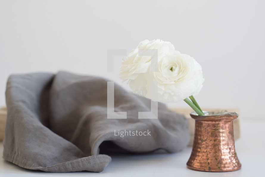 flowers in a vase and linen fabric 