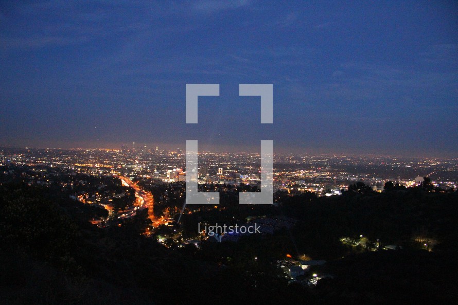 View of city lights from a mountain top.