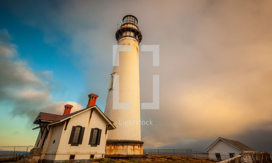 lighthouse and building at the coast 