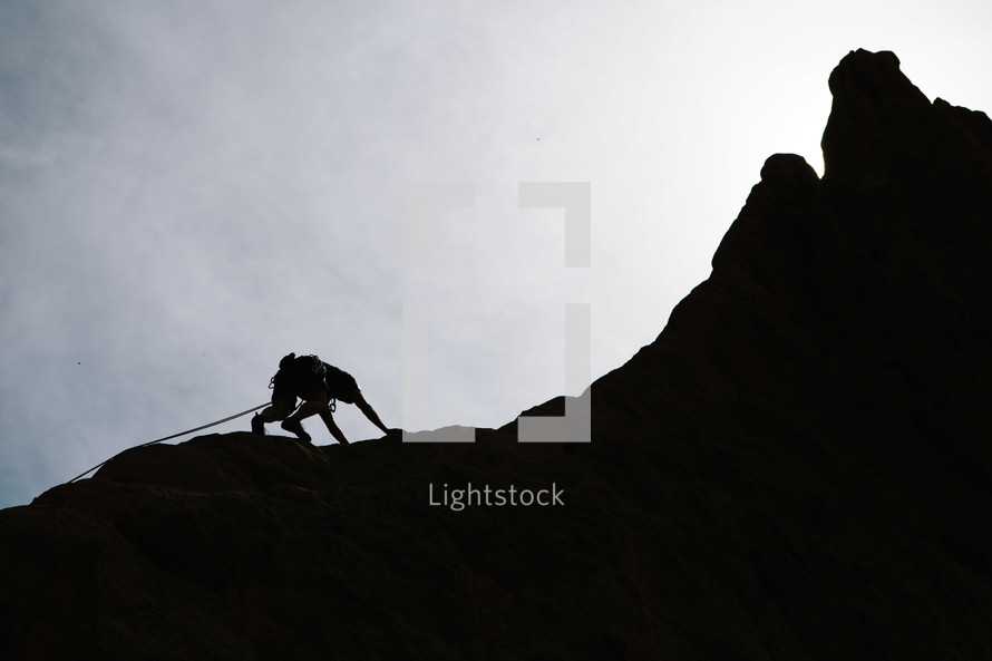 silhouette of a mountain climber 