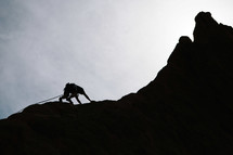 silhouette of a mountain climber 