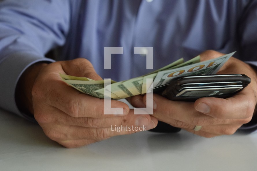 man holding his wallet and counting cash, debt, bills, paying, wealth, businessman