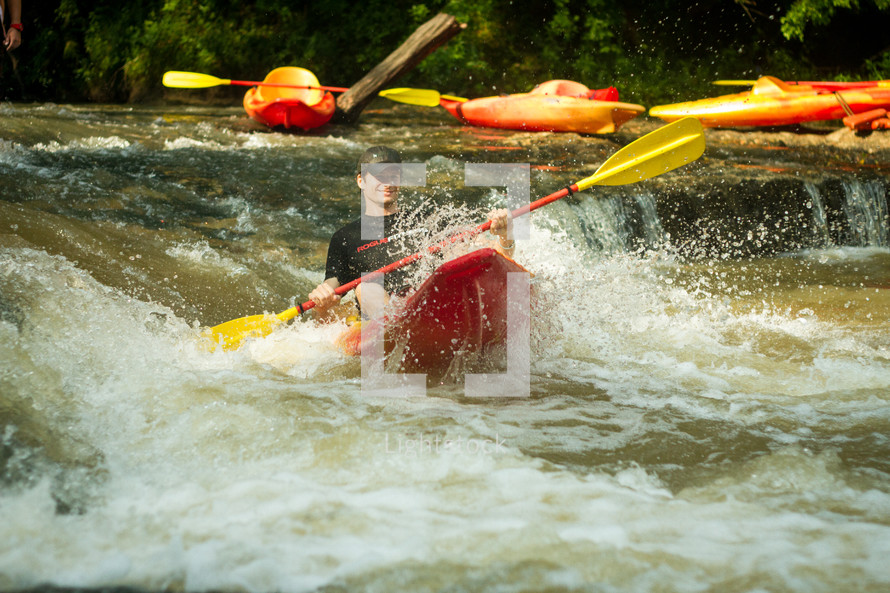 kayaker in rapids 