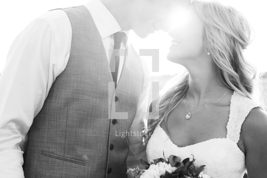 portrait of a bride and groom and intense sunlight