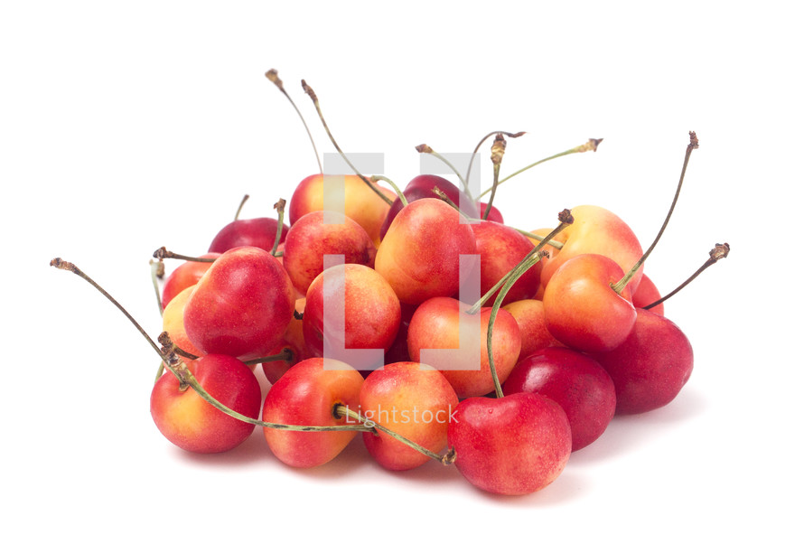 Sweet and Beautiful Red and Yellow Golden Cherries on a White Background