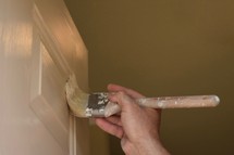 a man painting a door 