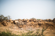 a pile of rocks in the desert 