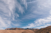 clouds over a desert landscape 