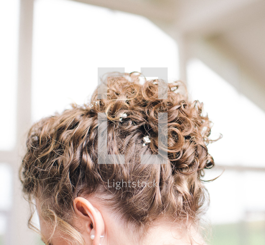 woman with an up do hairstyle 