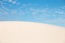 sand dunes under a blue sky 