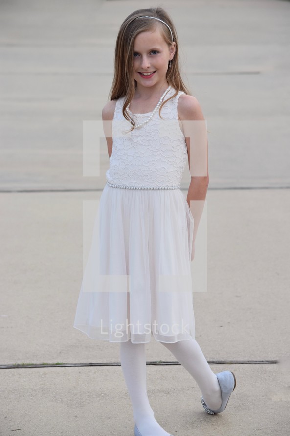 A shy little girl ready for a daddy daughter dance 