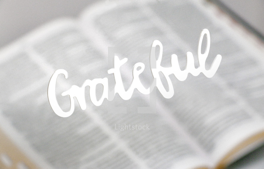 word grateful over an open Bible 