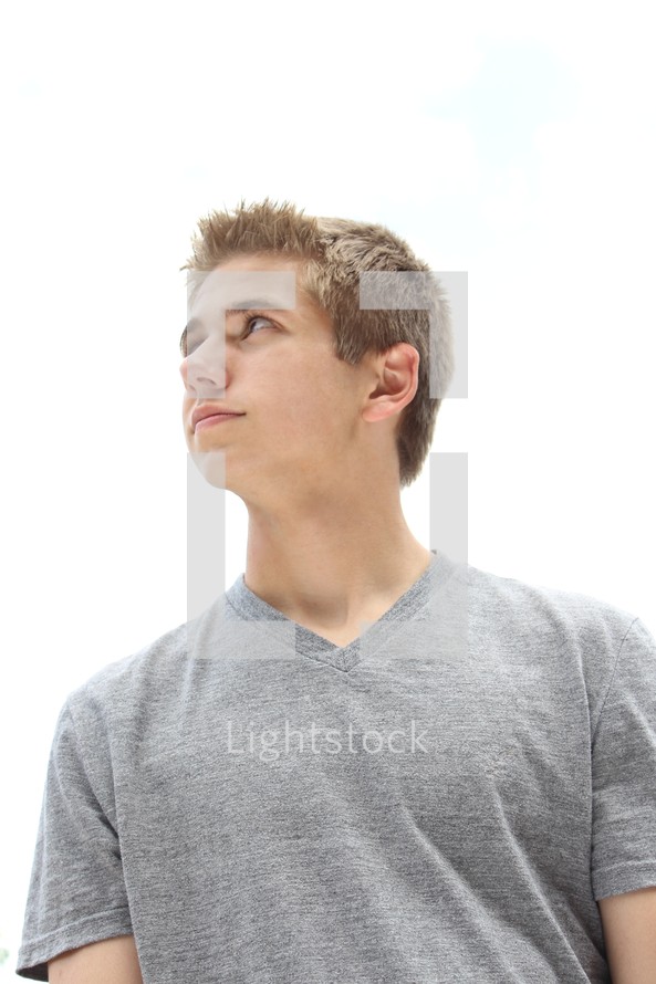 teen boy looking up to God