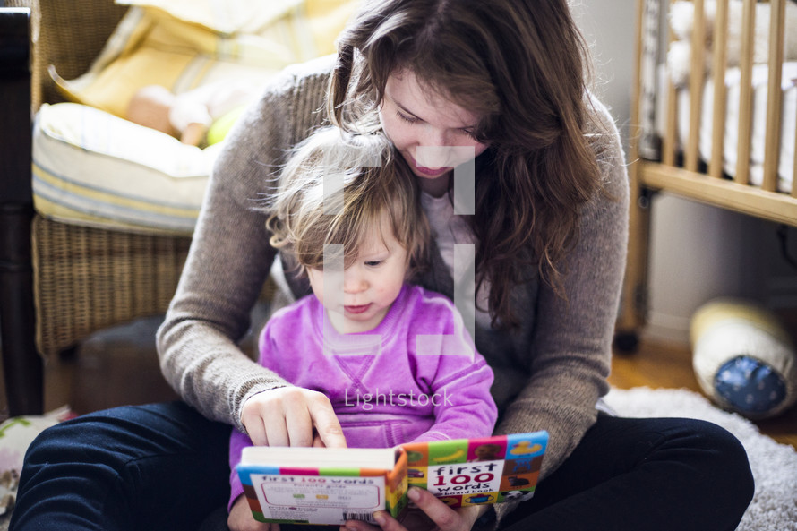 mother and toddler reading together 