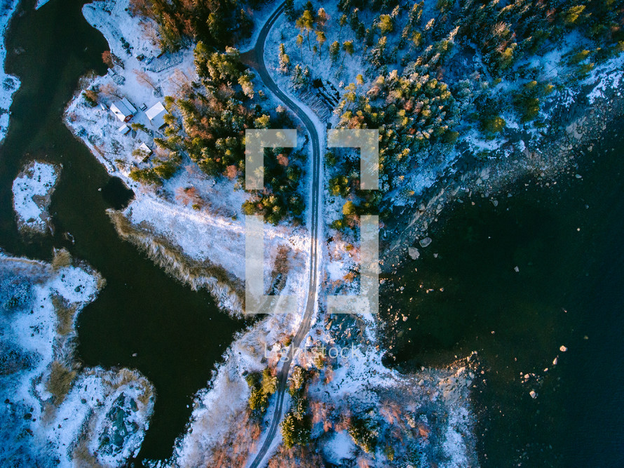 aerial view over a snowy highway 