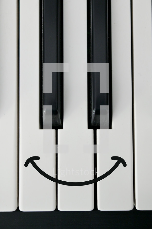 piano keys with a smiley face 