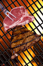 cooking steak on a grill 