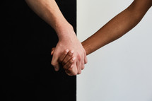 interracial couple holding hands 